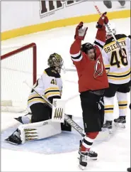  ?? BILL KOSTROUN - FREELANCER, AP ?? New Jersey Devils left wing Miles Wood (44) celebrates his goal as Boston Bruins goaltender Jaroslav Halak (41) reacts during the first period of an NHL hockey game Saturday, Jan. 16, 2021, in Newark, N.J.