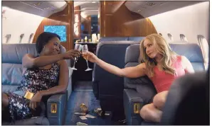  ?? STX Films / Contribute­d photo ?? Kirby Howell-Baptiste, left, and Kristen Bell in “Queenpins.”