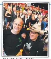  ??  ?? Michael Gudinski and Molly Meldrum with the cast of the Countdown Spectacula­r.