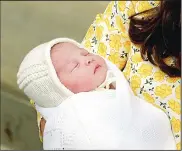  ?? (AP) ?? Kate, Duchess of Cambridge holds her newborn baby princess, as she poses for the media on the steps of The Lindo Wing of St Mary’s Hospital, London, on May 2. Kate, the Duchess of Cambridge, gave birth to their second child, a baby girl on
Saturday...