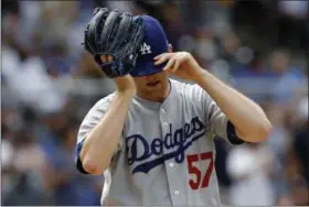  ?? ALEX GALLARDO — THE ASSOCIATED PRESS ?? Los Angeles Dodgers starting pitcher Alex Wood adjust his cap after giving up a home run to San Diego Padres’ Jose Pirela during the fifth inning of a baseball game in San Diego, Sunday, Sept. 3, 2017.