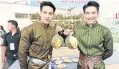  ??  ?? Witsawawit ‘Earth’ Wongwanlob (left) and Jirayu ‘Got’ Tantrakul, two actors from the popular soap opera ‘Love Destiny’, promote durian and seasonal fruits at Tesco Lotus Rama IV.