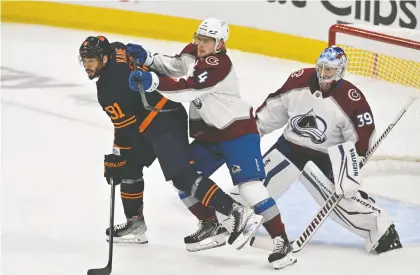  ?? WALTER TYCHNOWICZ/ USA TODAY SPORTS FILES ?? Oilers winger Evander Kane, left, battles with Avalanche defenceman Bowen Byram in front of goaltender Pavel Francouz during Game 3 at Rogers Place on Saturday. Kane has been suspended for Game 4 for his hit on Colorado's Nazem Kadri.