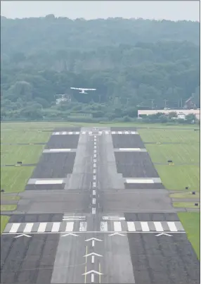  ?? H John Voorhees III / Hearst Connecticu­t Media ?? An airplane takes off from Danbury Municipal Airport into hazy skies on Wednesday.