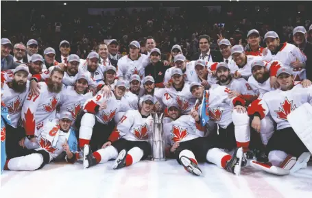  ?? CP PHOTO ?? Team Canada poses with the trophy following their victory over Team Europe in the World Cup of Hockey finals in Toronto on Thursday.