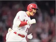  ?? Ashley Landis / Associated Press ?? Los Angeles Angels designated hitter Shohei Ohtani reacts as he runs the bases after hitting a two-run home against the Baltimore Orioles on July 2.
