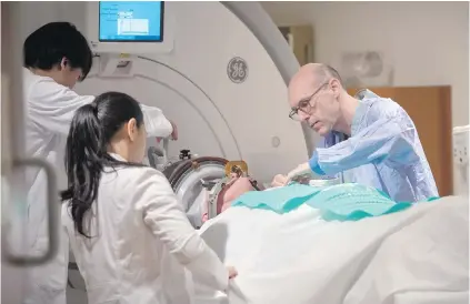  ??  ?? Rick Karr is prepared for treatment at Toronto’s Sunnybrook Health Sciences Centre. Karr was the first Alzheimer’s patient treated with focused ultrasound to open the blood-brain barrier.