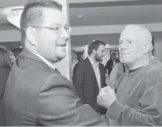  ??  ?? Mike Harris is congratula­ted by supporters gathered in St. Jacobs on election night.