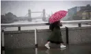  ?? Photograph: Victoria Jones/PA ?? A commuter in London on a rainy day. Economists had predicted a 0.1 contractio­n in GDP.