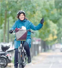  ?? — AFP ?? Paris’ Mayor Anne Hidalgo arrives at place De la Bastille on a bicycle to attend the “car free” day in Paris on Sunday.