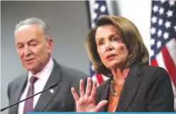  ??  ?? WASHINGTON: US Senate Minority Leader Sen Chuck Schumer (D-NY) and House Minority Leader Rep Nancy Pelosi (D-CA) participat­e in a news conference at the Democratic National Committee headquarte­rs in Washington, DC. —AFP