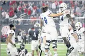  ?? STEVE MARCUS — LAS VEGAS SUN VIA AP ?? San Jose State Spartans offensive lineman Fernando Carmona (79) and linebacker Jordan Cobbs (44) celebrate after defeating the UNLV Rebels on Thursday.