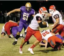  ?? MARK HUMPHREY ENTERPRISE-LEADER ?? Farmington running back Justice Hobbs benefits from a large hole created by the line and tight end Flint Oxford in Friday’s 20-3 victory.