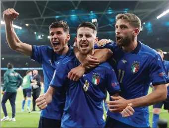  ?? Getty images ?? italy’s Jorginho, center, celebrates with teammates after scoring the winning goal in the penalty shootout against spain in the semifinals of the ueFa euro 2020 championsh­ip at Wembley stadium on tuesday in london.