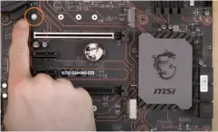  ??  ?? The M.2 slot will have a mounting system, such as the standoff with a screw shown here (see the orange circle, above), which keeps the SSD straight when it’s installed on the motherboar­d.
