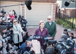  ?? SCOTT EISEN/GETTY IMAGES ?? Democratic presidenti­al candidate Sen. Elizabeth Warren (D-MA), with husband Bruce Mann, announces that she is dropping out of the presidenti­al race during a media conference Thursday outside of her home in Cambridge, Ma.