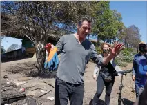  ?? ?? Governor Gavin Newsom speaks with media at a longstandi­ng homeless encampment along Highway 80 on Aug. 9, 2021, in Berkeley.