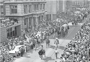  ?? TIMES RECORDER FILE PHOTO ?? This photo shows part of an extensive parade that took place in downtown Zanesville during the Zane’s Trace Commemorat­ion in years past. Thousands of people would line the streets for the parade and take part in the many events and contests such as the kissing and beard contests, and the anything that floats but a boat contest on the river.