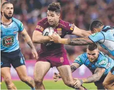  ??  ?? Aidan Guerra hits the line in Game One of State of Origin.