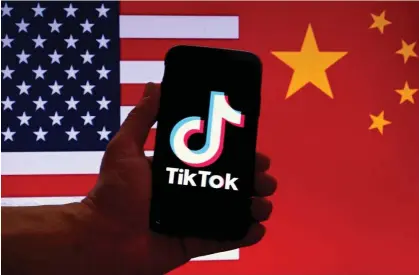  ?? Olivier Douliery/AFP/Getty Images ?? The committee on foreign investment in the US is threatenin­g a ban on the app unless its Chinese owners divest their stake. Photograph: