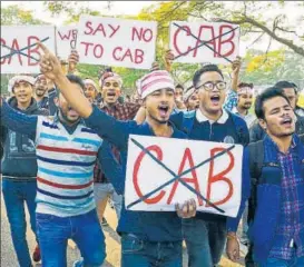  ?? PTI ?? Guwahati University students hold placards as they shout slogans against the Citizenshi­p Amendment Bill (CAB) on Monday
