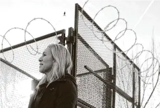  ?? Alex Wong / Getty Images ?? U.S. Rep. Marjorie Taylor Greene, R-Ga., walks past a fence that has been set up since the Jan. 6 insurrecti­on. Greene was removed from two House committees on Thursday for past remarks.