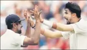  ?? REUTERS ?? Ishant Sharma (R) and R Ashwin shared eight wickets to bowl out England for 180 in the second innings on Friday.