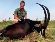  ??  ?? Backlash: Williams poses by a dead sable antelope