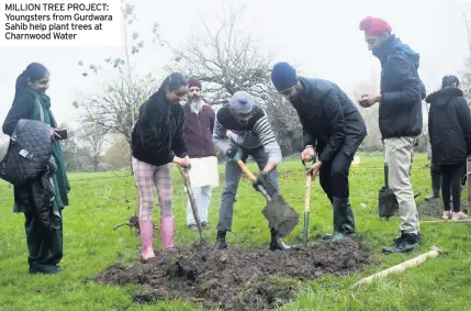  ??  ?? MILLION TREE PROJECT: Youngsters from Gurdwara Sahib help plant trees at Charnwood Water