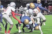  ?? / Contribute­d by Gail Conner ?? The St. Pius defense tries to stop Cedartown’s Kobe Pryor while on the run.