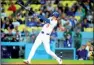  ?? PHOTO: KIRBY LEE-USA TODAY ?? The Los Angeles Dodgers’ Shohei Ohtani hits a solo home run against the San Diego Padres at Dodger Stadium on Friday.