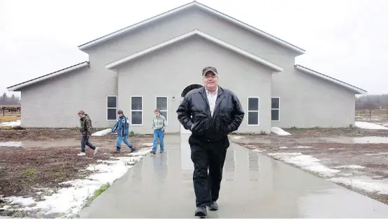  ?? JONATHAN HAYWARD/THE CANADIAN PRESS ?? Winston Blackmore is seen outside his local community hall. Blackmore is currently awaiting sentencing on a polygamy conviction.