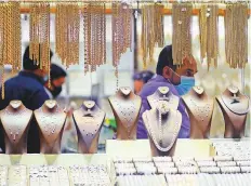  ?? Clint Egbert/Gulf News ?? The Gold Souk in Deira shows signs of life again after easing
■ of restrictio­ns introduced due to Covid-19. Some retailers had been offering price lock-in programmes since early March.
