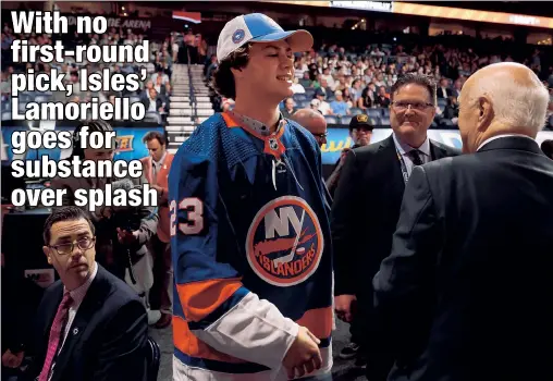  ?? Getty Images ?? ANOTHER NELSON: Danny Nelson, the Islanders’ second-round pick in the 2023 NHL Draft, has a word with GM Lou Lamoriello after he was taken 49th overall on Thursday. Nelson said he models his game after another Nelson: the Islanders’ Brock Nelson.