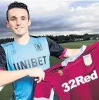  ??  ?? KITTED OUT McGinn poses with Villa shirt