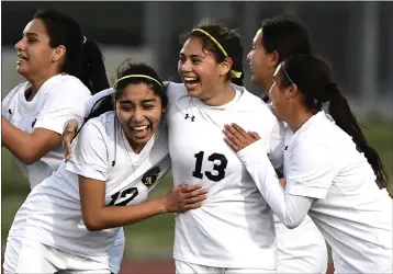  ?? PHOTOS BY WILL LESTER – STAFF PHOTOGRAPH­ER ?? HIGH SCHOOL GIRLS SOCCER
North’s Leilani Lepe (13) celebrates with teammates after scoring to give the Huskies a 1-0lead over Ramona.