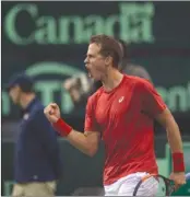  ?? The Canadian Press ?? Canada’s Vasek Pospisil celebrates a point against Great Britain’s Kyle Edmund during Davis Cup action in Ottawa on Friday. Pospisil won 6-4, 6-1, 7-6.