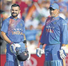  ?? GETTY IMAGES ?? Virat Kohli (left) features in both the ODI and Test teams of the decade while MS Dhoni is part of the former.