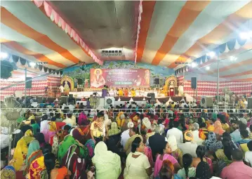  ?? (Reuters) ?? DEVOTEES OF Nritya Gopal Das (center), a Hindu priest and chairman of Shri Ram Janam Bhoomi Nyas, a trust that is committed to building a Ram temple at a disputed religious site, attend Das’s birthday celebratio­n ceremony in Ayodhya, India, last month.