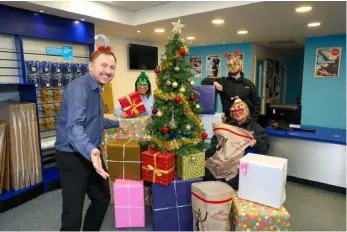  ?? ?? GIFTING:
Access Self-Storage stores have been collecting gifts to donation to Spread a Smile
