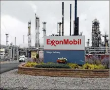  ?? MATTHEW BROWN / AP 2016 ?? Exxon Mobil reports its profit fell 21% to $3.1 billion, coinciding with a 24% drop in natural gas prices. Margins in its refining business remained near five-year lows.