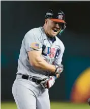  ?? GODOFREDO A. VÁSQUEZ/AP ?? Team USA’s Mike Trout celebrates after hitting a two-run single against Colombia during a World Baseball Classic game Wednesday in Phoenix.