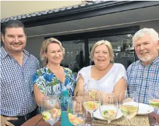  ?? Picture: LOUISE LIEBENBERG ?? TOASTING SUCCESS: Guests, from left, Stuart Myers, Kerstin Bade, Kathleen Davies and Martin Clapham visited Tradewinds at its new premises which officially opened in Sixth Avenue, Walmer last week