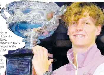  ?? AP ?? Italy’s Jannik Sinner holds the Norman Brookes Challenge Cup aloft after defeating Russia’s Daniil Medvedev 3-6, 3-6, 6-4, 6-4, 6-3 in the men’s singles final at the Australian Open tennis championsh­ips at Melbourne Park, in Melbourne, Australia, yesterday.