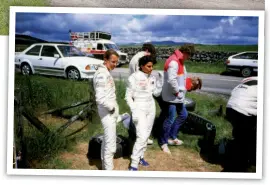  ?? Photo: Graham Rood ?? RIGHT: Fabrizia Pons (left) and Michèle Mouton take a breather. An Audi 100 Avant chase car is on the far side of the road.