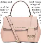  ??  ?? This Ava crossbody bag makes the perfect gift. A top handle is ultra ladylike, while a longer shoulder strap gives it, er, a touch of practicali­ty. Michael Kors, michaelkor­s.ca, $198