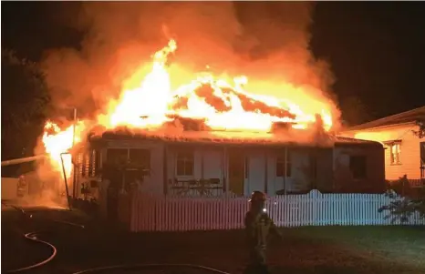  ??  ?? HOUSE INFERNO: The Hayden St home in Dalby was engulfed in flames within minutes. PHOTO: MICHAEL DOYLE