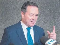  ?? RYAN REMIORZ THE CANADIAN PRESS FILE PHOTO ?? The federal cabinet is putting its ear very close to the wall of Alberta Premier Jason Kenney’s echo chamber, straining to listen past the threats and insults in search of some kind of way forward, Heather Scoffield writes.