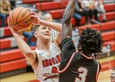  ?? For the Post-Gazette ?? Peters Township’s Jack Dunbar, left, tries to get a shot against the defense of Upper St. Clair’s Devin Hall Tuesday.