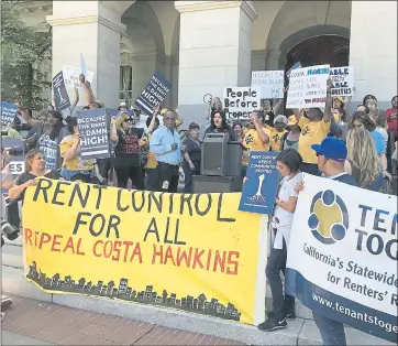  ?? PHOTO BY KATY MURPHY ?? Tenants rally in Sacramento on Monday, April 23. A campaign to repeal a state law restrictin­g rent control says it has delivered the signatures required to get the initiative on the November 2018 ballot.